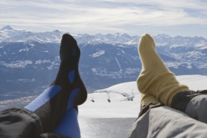 Resting feet on bench with mountain view